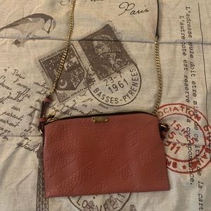 Small Burberry crossbody bag with adjustable strap- comes with dust bag.